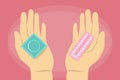 Condom and contraceptive pill in hands isolated