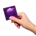 Condom in female hand isolated