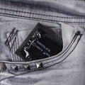 Condom in the grey jeans Royalty Free Stock Photo