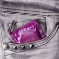 Condom in the grey jeans Royalty Free Stock Photo