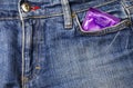 Condom and jeans Royalty Free Stock Photo