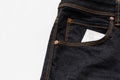 Condom in the jeans pocket with word safty first