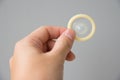 Condom in somebody hand Royalty Free Stock Photo