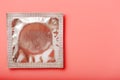 Condom transparent on a pink background, close-up, top view. Safe sex concept Royalty Free Stock Photo