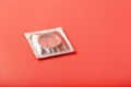 Condom transparent on a pink background, close-up, top view. Safe sex concept Royalty Free Stock Photo