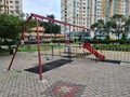 KUALA LUMPUR, MALAYSIA - August 3, 2020 : Condominium facilities with kids playing monkey bar during Covid 19 pandemic at playgrou