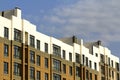 Condominium or modern apartment building with symmetrical architecture in the city downtown. Real estate development and urban