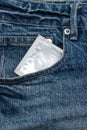 Condoms in package in jeans.