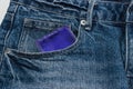 Condoms in package in jeans.