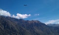 Condor flying above mountains