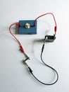 Conductivity experiment with a battery as a voltage source Royalty Free Stock Photo