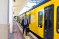 The conductor next to the train in Europe Royalty Free Stock Photo