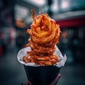 A cone of hot and crispy onion rings Royalty Free Stock Photo