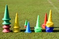 Cone markers on the green grass playground Royalty Free Stock Photo