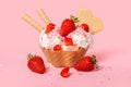 cone with scoops of ice cream strewed sprinkles, poured with glaze and decorated strawberries on pink background Royalty Free Stock Photo