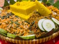 Cone-shaped yellow rice is an Indonesian traditional food, called Nasi Tumpeng. Royalty Free Stock Photo