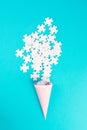 Cone with white puzzle pieces, blue background, spreading the jigsaw parts, searching for ideas and solutions, brainstorming Royalty Free Stock Photo