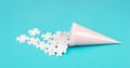 Cone with white puzzle pieces, blue background, spreading the jigsaw parts, searching for ideas and solutions, brainstorming Royalty Free Stock Photo