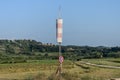 Cone wind indicator and stop sign and parking are prohibited on the runway at the airport to measure wind speed