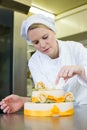 Confectioner, baker or pastry cook preparing cake Royalty Free Stock Photo