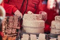 Confectioner cutting halva pieces