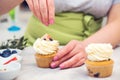 Confectioner decorating cupcakes. Cooking class, culinary and bakery Royalty Free Stock Photo