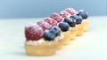 Confectioner prepares tartlets