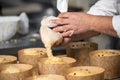 Confectioner topping panettone cakes with piping bag glazed sweet filling