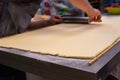 Confectioner works the puff pastry dough, artisan, gourmet