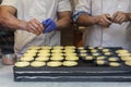 Confectioners makin the famous Portuguese cake Pastel de nata