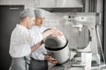 Confectioners working at the bakery manufacturing