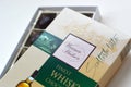 Confectionery box of Warner Hudson finest whisky chocolates flavoured with teachers blended scotch whisky. Beige and green pack of