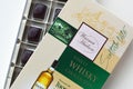 Confectionery box of Warner Hudson finest whisky chocolates flavoured with teachers blended scotch whisky. Beige and green pack of