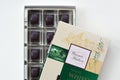 Confectionery box of Warner Hudson finest whisky chocolates flavoured with teachers blended scotch whisky. Beige and green pack of