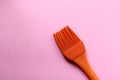 Confectionery brush on a pink background