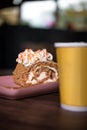confectionery dessert roll with yellow cup of coffee