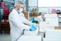 Confectionery factory employee preparing empty box Royalty Free Stock Photo