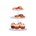 Confectionery on serving plate. Sweet desserts on 3-layered tray. Confection, yummy treats. Cupcakes, eclairs, macarons