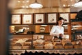 Confectionery. Woman Selling Chocolate Candies In Store