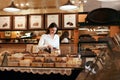 Confectionery. Woman Selling Chocolate Candies In Store