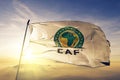 Confederation of African Football logo flag textile cloth fabric waving on the top sunrise mist fog