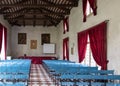 Conference hall in ancient villa with canvas blue chairs and red