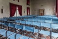 Conference hall in ancient villa with canvas blue chairs and red