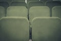 Conference hall or cinema interior with rows of green chairs Royalty Free Stock Photo