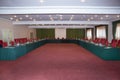 Conference hall at the hotel. Red tables and red carpet . Elegant and rich designed banquet hall. Great file for your new catering Royalty Free Stock Photo