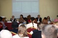 conference with lecturers and students in the hall with red chairs Royalty Free Stock Photo