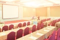 Conference Meeting Room , Row of  Chairs with Stage and Empty Screen for Business Meeting, Conference, Training Course, used as Royalty Free Stock Photo