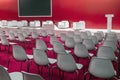 Conference Meeting Room, Row of White Chairs, with Stage Royalty Free Stock Photo