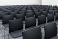 Conference and Meeting Room with Rows of Black Chairs Royalty Free Stock Photo