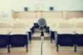 Before a conference, the microphones in front of empty chairs. Royalty Free Stock Photo